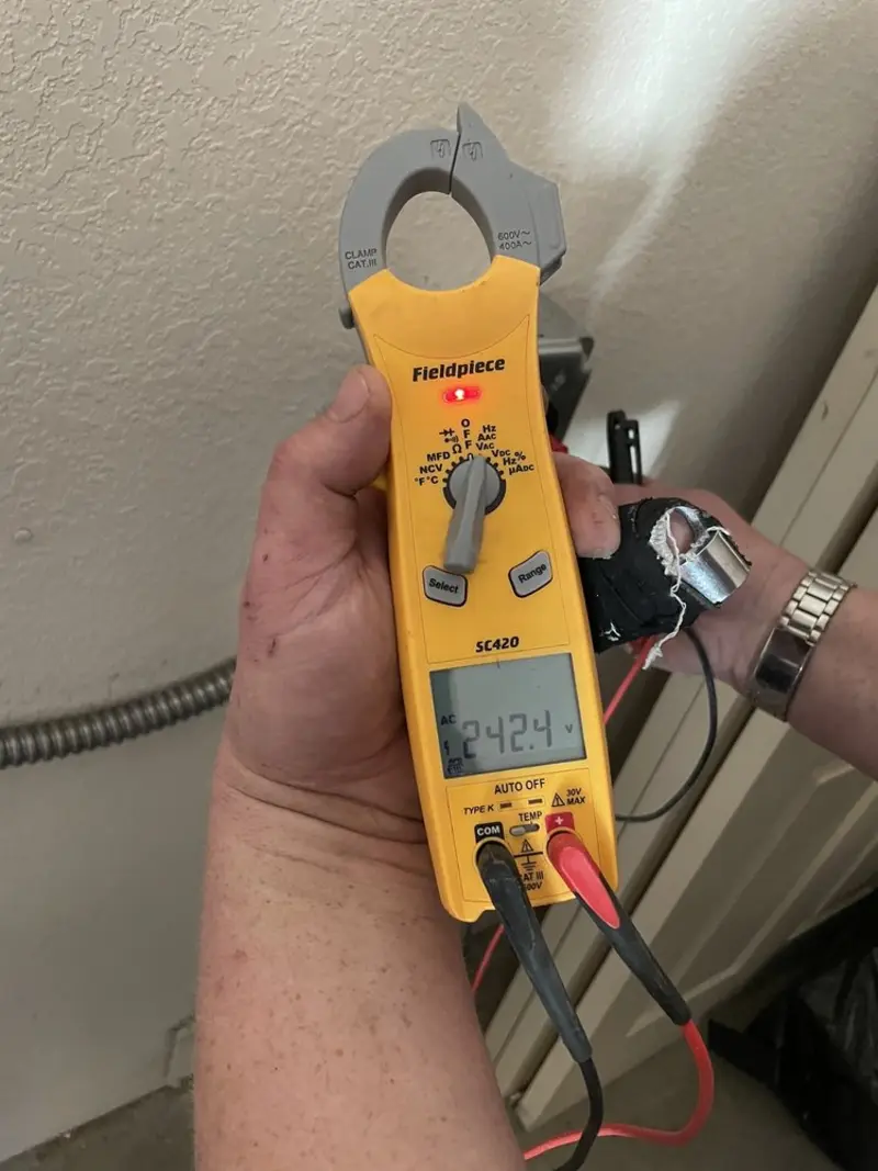 Voltage testing with clamp meter during Aluminum Wiring Replacement in St. Paul Park